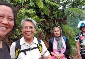 Columban missionaries Sr. Ashwena Apao (left) and Sr. Minerva Dangaran (second from left) and friends in the Philippines.