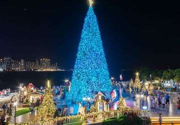 Christmas tree and decoration with skyline of Victoria harbor of Hong Kong city