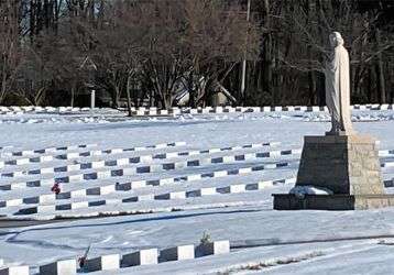 Snow blankets a cemetery 