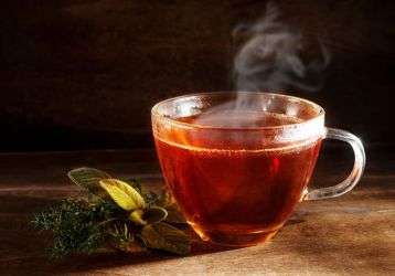 Steaming cup of tea on a table